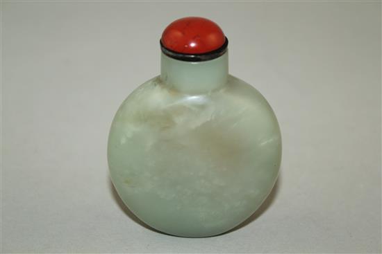 A Chinese pale celadon and russet jade snuff bottle, 6.5cm